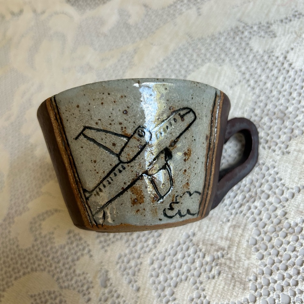 Funny airplane travel pottery mug signed